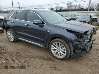 2022 Cadillac XT4 AWD Premium Luxury with VIN 1GYFZDR42NF147920, listed as a Copart auction lot 84058554 with 12,145 mi miles and Salvage Title. Bid and sale history available at carsss.com. Image 4.