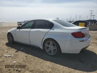 2013 BMW 5 Series 550i xDrive with VIN WBAFU9C52DDY71651, listed as a Copart auction lot 52156465 with 144,211 mi miles and Salvage title. Bid and sale history available at DreamBid. Image 2.