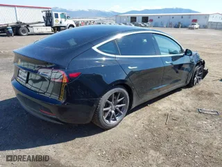 2019 Tesla Model 3 Mid Range with VIN 5YJ3E1EA3KF304286, listed as a IAAI auction lot 42066908 with 164,667 mi miles. Bid and sale history available at carsss.com. Image 4.