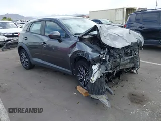2018 Mazda CX-3 Touring z VIN JM1DKFC7XJ0312349, wystawiony jako IAAI lot #42368311 z przebiegiem 97 772 mil mil oraz . Historia ofert i sprzedaży dostępna na DreamBid. Obrazek 1.