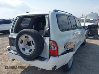 2003 Suzuki XL7 Touring z VIN JS3TY92V534106381, wystawiony jako IAAI lot #42063755 z przebiegiem 190 917 mil mil oraz . Historia ofert i sprzedaży dostępna na DreamBid. Obrazek 4.