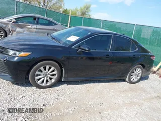 2019 Toyota Camry LE with VIN 4T1B11HK1KU718374, listed as a IAAI auction lot 42071905 with 86,460 mi miles and . Bid and sale history available at DreamBid. Image 14.