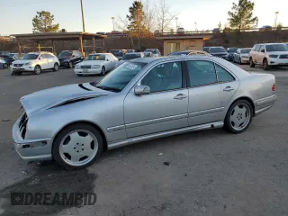 2000 Mercedes-Benz E-Class with VIN WDBJF70JXYB113988, listed as a Copart auction lot 86325514 with 198,321 mi miles and Salvage Title. Bid and sale history available at carsss.com. Image 1.