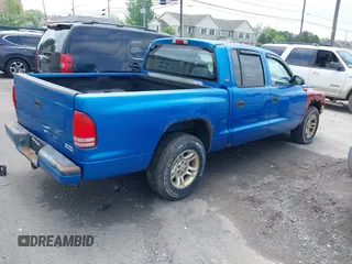 2001 Dodge Dakota Sport z VIN 1B7GL2AN31S115001, wystawiony jako IAAI lot #42452634 z przebiegiem Nie podano mil oraz . Historia ofert i sprzedaży dostępna na DreamBid. Obrazek 4.