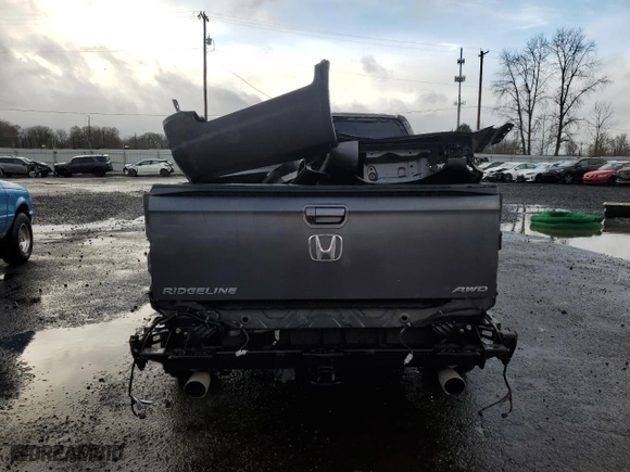 2021 Honda Ridgeline RTL-E with VIN 5FPYK3F74MB015036, listed as a Copart auction lot 43269105 with 64,631 mi miles and Salvage Title. Bid and sale history available at carsss.com. Image 6.