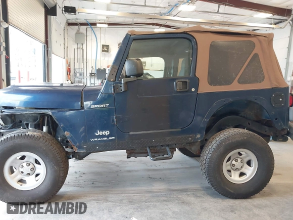 2003 Jeep Wrangler Sport with VIN 1J4FA49S53P311822, listed as a IAAI auction lot 41621710 with 156,023 mi miles. Bid and sale history available at carsss.com. Image 14.