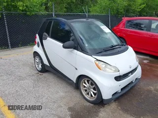 2009 Smart fortwo Passion z VIN WMEEK31X79K210918, wystawiony jako IAAI lot #42316213 z przebiegiem 99 667 mil mil oraz . Historia ofert i sprzedaży dostępna na DreamBid. Obrazek 1.