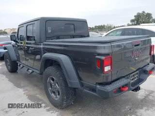 2020 Jeep Gladiator Rubicon with VIN 1C6JJTBG8LL135573, listed as a IAAI auction lot 41585896 with 79,070 mi miles and . Bid and sale history available at DreamBid. Image 3.