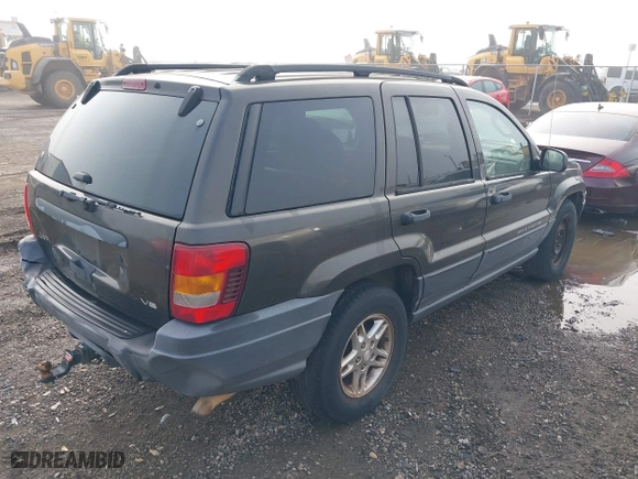 2004 Jeep Grand Cherokee Laredo with VIN 1J4GX48N74C385749, listed as a IAAI auction lot 41877421 with 141,255 mi miles. Bid and sale history available at carsss.com. Image 4.