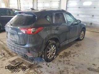 2015 Mazda CX-5 Touring with VIN JM3KE2CY2F0458114, listed as a IAAI auction lot 41545493 with 138,061 mi miles. Bid and sale history available at carsss.com. Image 4.