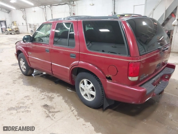 1999 Oldsmobile Bravada with VIN 1GHDT13W9X2701952, listed as a IAAI auction lot 42093184 with 121,532 mi miles. Bid and sale history available at carsss.com. Image 3.