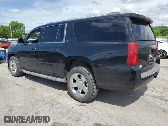 2015 Chevrolet Suburban LTZ with VIN 1GNSCKKC9FR151532, listed as a Copart auction lot 54209315 with 122,380 mi miles and Salvage title. Bid and sale history available at DreamBid. Image 2.