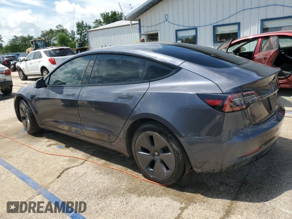 2023 Tesla Model 3 with VIN 5YJ3E1EA4PF614129, listed as a Copart auction lot 62019385 with 23,218 mi miles and Salvage title. Bid and sale history available at DreamBid. Image 2.
