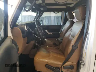 2015 Jeep Wrangler Unlimited Sahara с VIN 1C4HJWEG0FL560973, выставлен на аукционе Copart как лот 59552135 с пробегом 135 057 миль миль и Чистый • Clean title. История ставок и продаж доступна на DreamBid. Изображение 7.