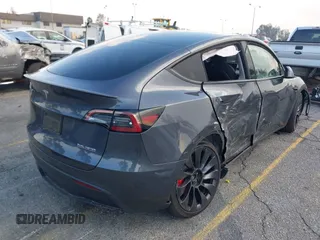 2023 Tesla Model Y Performance with VIN 7SAYGDEF6PF837174, listed as a IAAI auction lot 41436629 with 22,799 mi miles and . Bid and sale history available at DreamBid. Image 4.