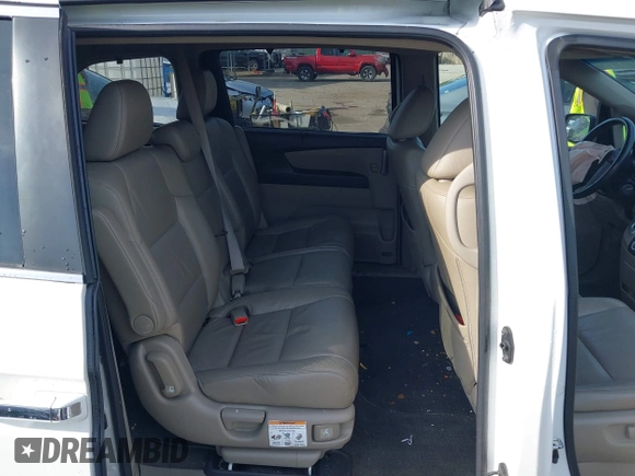 2011 Honda Odyssey EX-L with VIN 5FNRL5H6XBB059162, listed as a IAAI auction lot 42061378 with 164,317 mi miles and . Bid and sale history available at carsss.com. Image 8.