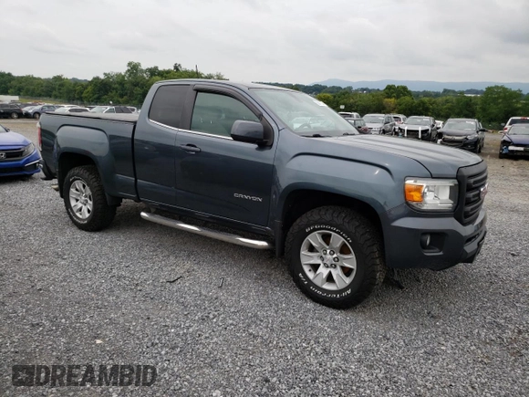 2015 GMC Canyon 2WD SLE with VIN 1GTH5BEA7F1158758, listed as a Copart auction lot 63617524 with 102,744 mi miles and Salvage Title. Bid and sale history available at carsss.com. Image 4.