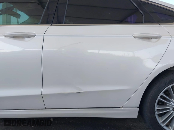 2013 Ford Fusion SE Hybrid z VIN 3FA6P0LU1DR310075, wystawiony jako IAAI lot #42085556 z przebiegiem Nie podano mil oraz . Historia ofert i sprzedaży dostępna na DreamBid. Obrazek 13.