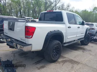 2005 Nissan Titan LE with VIN 1N6AA07BX5N525048, listed as a IAAI auction lot 41984150 with 242,321 mi miles. Bid and sale history available at carsss.com. Image 4.