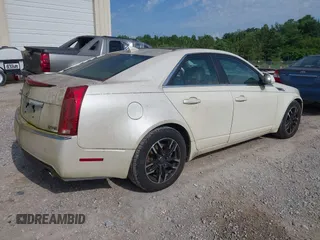 2009 Cadillac CTS RWD with VIN 1G6DF577690108865, listed as a IAAI auction lot 42314121 with 153,702 mi miles and . Bid and sale history available at DreamBid. Image 4.