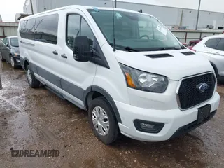 2023 Ford Transit Passenger XL with VIN 1FBAX2YG2PKA91028, listed as a IAAI auction lot 42106198 with 52,874 mi miles. Bid and sale history available at carsss.com. Image 1.