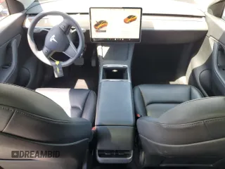2022 Tesla Model Y Long Range z VIN 7SAYGDEE2NF513823, wystawiony jako Copart lot #51174795 z przebiegiem 28 143 mil mil oraz Szkody całkowita. Historia ofert i sprzedaży dostępna na DreamBid. Obrazek 8.