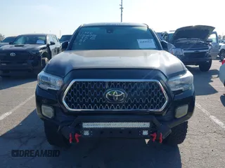 2019 Toyota Tacoma SR z VIN 5TFCZ5AN9KX199814, wystawiony jako IAAI lot #41841821 z przebiegiem 69 276 mil mil oraz . Historia ofert i sprzedaży dostępna na DreamBid. Obrazek 12.