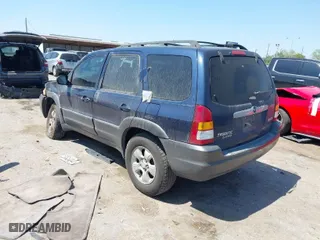 2003 Mazda Tribute LX with VIN 4F2CZ04133KM23234, listed as a IAAI auction lot 41869955 with 240,898 mi miles. Bid and sale history available at carsss.com. Image 3.