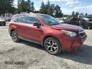 2014 Subaru Forester XT Touring with VIN JF2SJGMC0EH513844, listed as a Copart auction lot 61162355 with 56,887 mi miles and Salvage title. Bid and sale history available at DreamBid. Image 4.