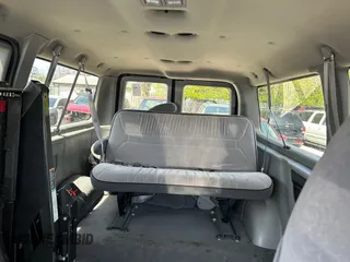 1998 Ford Econoline Passenger XL with VIN 1FMRE11L6WHB65841, listed as a IAAI auction lot 42123953 with 63,138 mi miles. Bid and sale history available at carsss.com. Image 8.