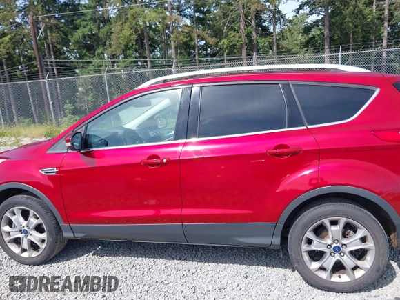 2015 Ford Escape Titanium with VIN 1FMCU9J93FUB28037, listed as a IAAI auction lot 42432345 with 133,242 mi miles and . Bid and sale history available at DreamBid. Image 14.
