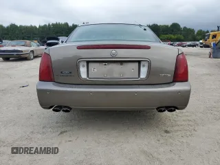 2000 Cadillac DeVille DTS z VIN 1G6KF5794YU249059, wystawiony jako Copart lot #71614494 z przebiegiem 121 611 mil mil oraz Szkoda całkowita • Salvage title. Historia ofert i sprzedaży dostępna na DreamBid. Obrazek 6.
