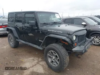2012 Jeep Wrangler Unlimited Rubicon z VIN 1C4HJWFGXCL142804, wystawiony jako IAAI lot #42183960 z przebiegiem 124 392 mil mil oraz . Historia ofert i sprzedaży dostępna na DreamBid. Obrazek 1.