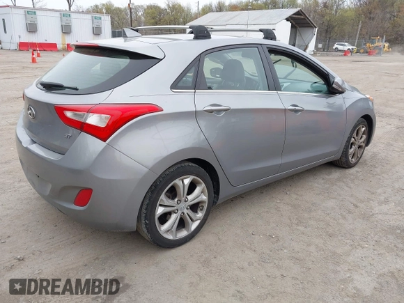 2014 Hyundai Elantra GT with VIN KMHD35LH6EU165019, listed as a IAAI auction lot 42016057 with 121,794 mi miles. Bid and sale history available at carsss.com. Image 4.