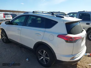 2017 Toyota RAV4 XLE with VIN JTMRFREV5HJ123412, listed as a IAAI auction lot 42018549 with 127,974 mi miles. Bid and sale history available at carsss.com. Image 3.