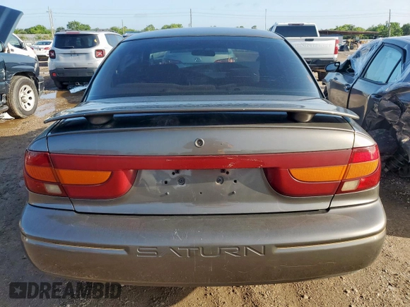 2000 Saturn SL with VIN 1G8ZK5278YZ160430, listed as a Copart auction lot 61234185 with 89,221 mi miles and Salvage title. Bid and sale history available at DreamBid. Image 6.