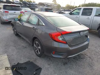 2019 Honda Civic Sedan LX with VIN 19XFC2F60KE018100, listed as a IAAI auction lot 41908486 with 124,357 mi miles. Bid and sale history available at carsss.com. Image 3.