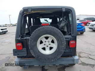 2004 Jeep Wrangler Sport with VIN 1J4FA49S64P794559, listed as a IAAI auction lot 41644201 with 107,445 mi miles. Bid and sale history available at carsss.com. Image 17.
