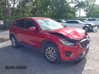 2016 Mazda CX-5 Sport with VIN JM3KE2BY8G0751387, listed as a IAAI auction lot 42703007 with 110,946 mi miles and . Bid and sale history available at DreamBid. Image 1.