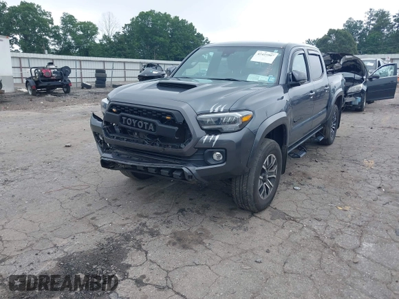 2022 Toyota Tacoma SR with VIN 3TMCZ5AN2NM507478, listed as a IAAI auction lot 42425907 with 40,796 mi miles and . Bid and sale history available at DreamBid. Image 2.