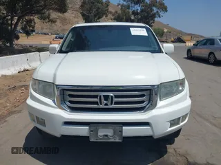 2012 Honda Ridgeline RTL z VIN 5FPYK1F57CB455267, wystawiony jako IAAI lot #42462296 z przebiegiem 186 451 mil mil oraz . Historia ofert i sprzedaży dostępna na DreamBid. Obrazek 12.
