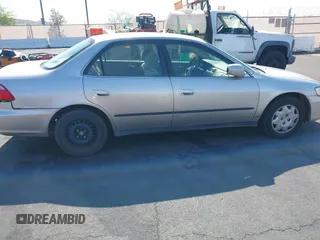 1999 Honda Accord LX with VIN JHMCG6650XC011621, listed as a IAAI auction lot 42401527 with 243,227 mi miles and . Bid and sale history available at DreamBid. Image 12.
