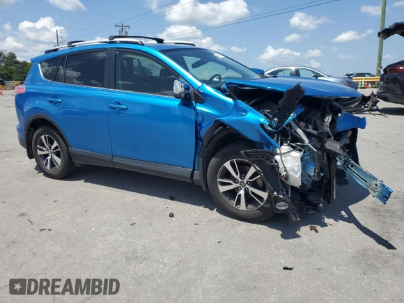 2016 Toyota RAV4 XLE with VIN JTMRFREV2GJ058808, listed as a Copart auction lot 61449135 with 73,985 mi miles and Salvage title. Bid and sale history available at DreamBid. Image 4.
