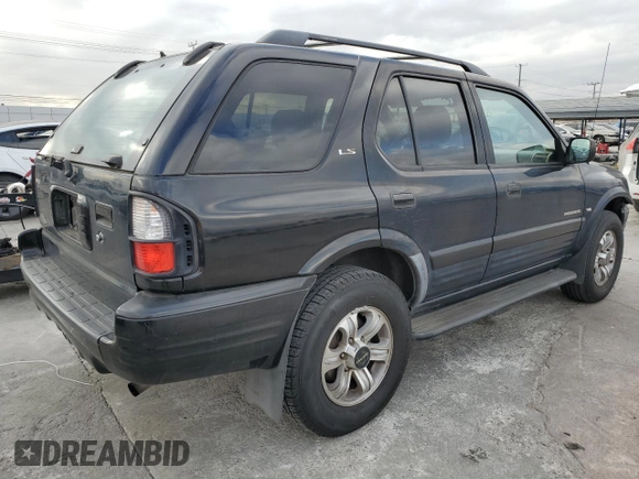2001 Isuzu Rodeo S with VIN 4S2CK58W814333364, listed as a Copart auction lot 84656114 with 140,489 mi miles and Salvage title. Bid and sale history available at DreamBid. Image 3.