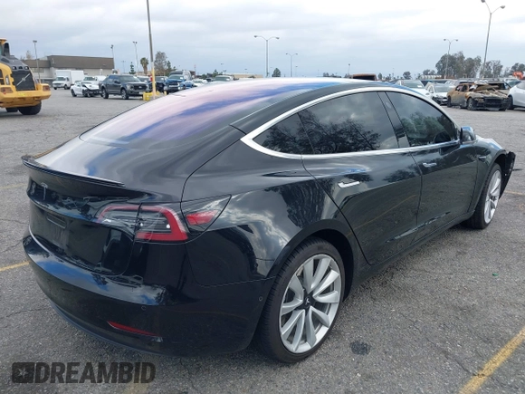 2018 Tesla Model 3 Long Range Battery with VIN 5YJ3E1EA9JF009384, listed as a IAAI auction lot 41544624 with 66,896 mi miles and . Bid and sale history available at DreamBid. Image 4.