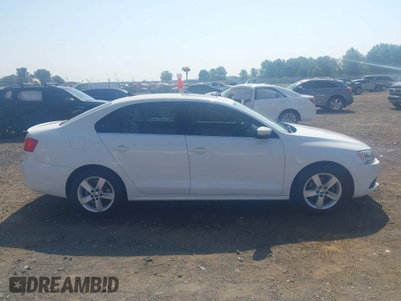2014 Volkswagen Jetta TDI w/Premium/Nav with VIN 3VWLL7AJXEM366828, listed as a IAAI auction lot 42392563 with 132,924 mi miles and . Bid and sale history available at DreamBid. Image 13.