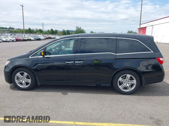 2012 Honda Odyssey Touring with VIN 5FNRL5H93CB121190, listed as a IAAI auction lot 42223998 with 154,358 mi miles and . Bid and sale history available at DreamBid. Image 14.