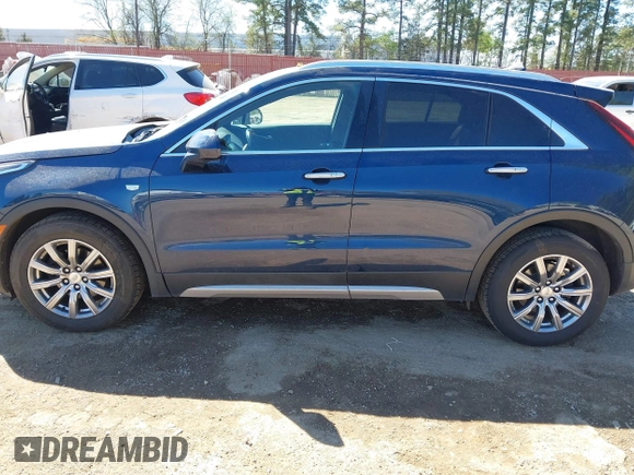 2019 Cadillac XT4 FWD Premium Luxury z VIN 1GYFZCR47KF109394, wystawiony jako IAAI lot #41864606 z przebiegiem 98 425 mil mil oraz . Historia ofert i sprzedaży dostępna na DreamBid. Obrazek 14.