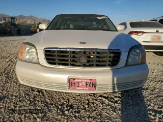 2001 Cadillac DeVille DHS z VIN 1G6KE57Y31U229255, wystawiony jako Copart lot #75101214 z przebiegiem 141 187 mil mil oraz Czysty tytuł • Clean title. Historia ofert i sprzedaży dostępna na DreamBid. Obrazek 5.
