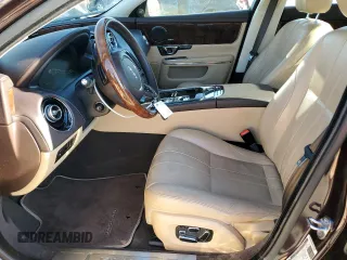 2014 Jaguar XJ with VIN SAJWA1CZ3E8V69877, listed as a Copart auction lot 48159005 with 57,567 mi miles and Clean Title. Bid and sale history available at DreamBid. Image 7.